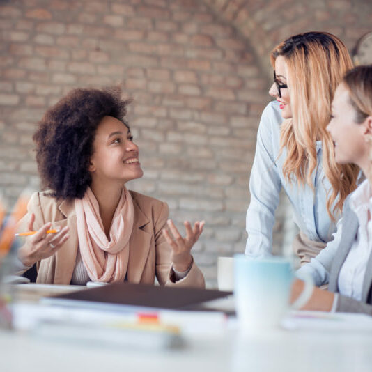 Young professional team.Young team of coworkers making great business discussion in modern office.