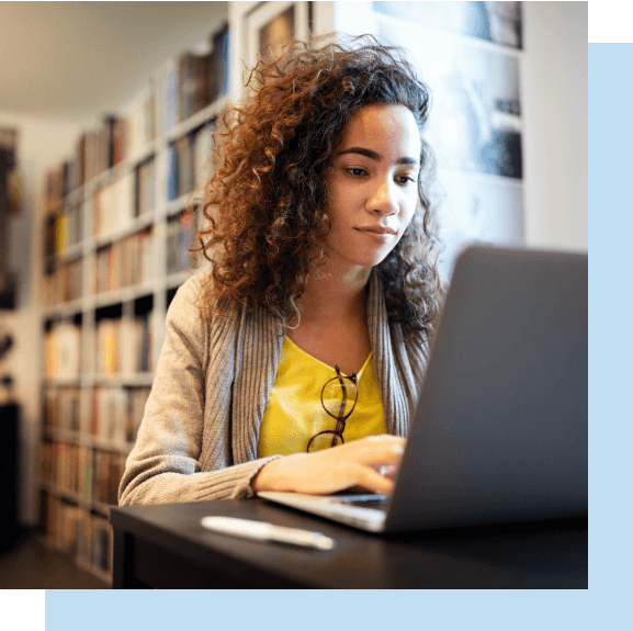 A female law student takes BARBRI MPRE Review while at the law library