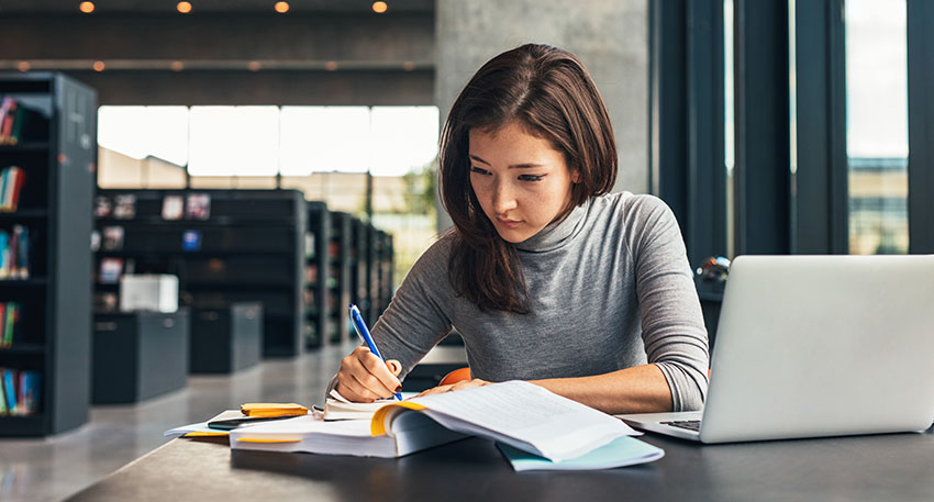 A female 3L law student does research about the bar exam