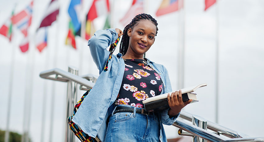 A female foreign law student walks across campus