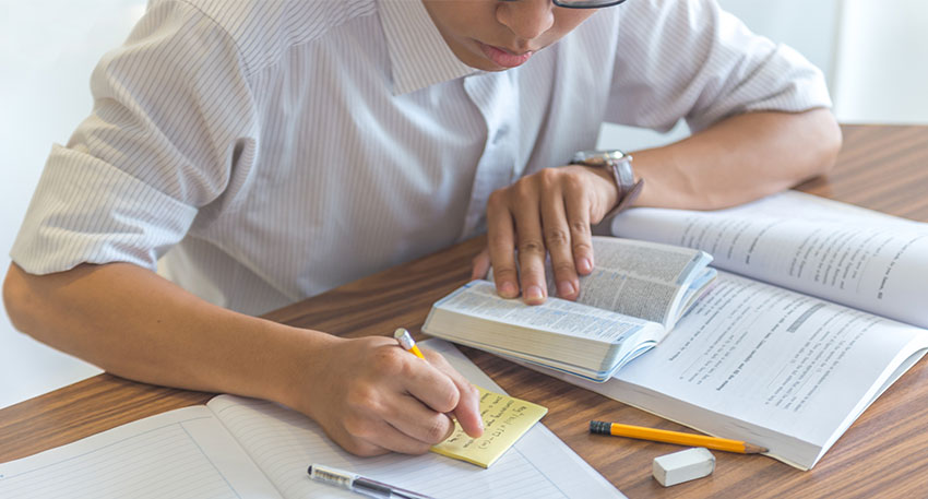 A male law student takes notes about the MPRE