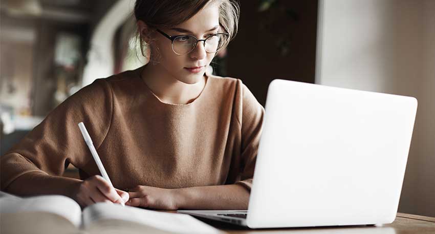 A female law student works on law school case briefs