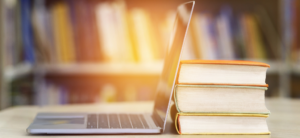 laptop-on-desk-against-law-books