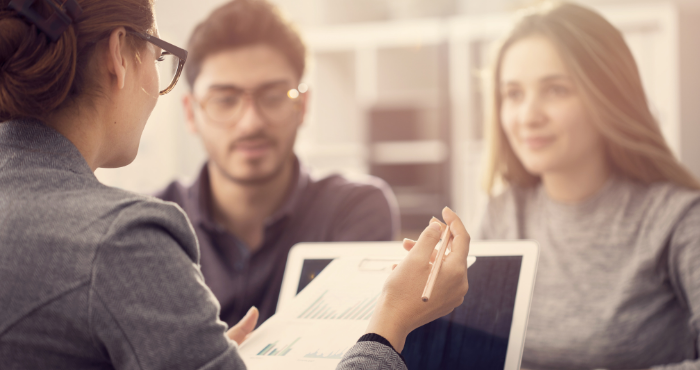 three-professionals-at-table-in-work-environment