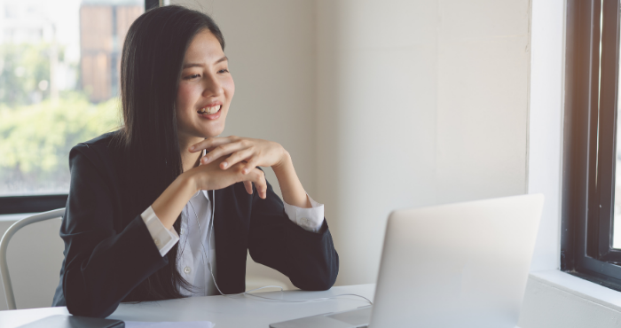 woman-at-laptop-talking-at-conference-call